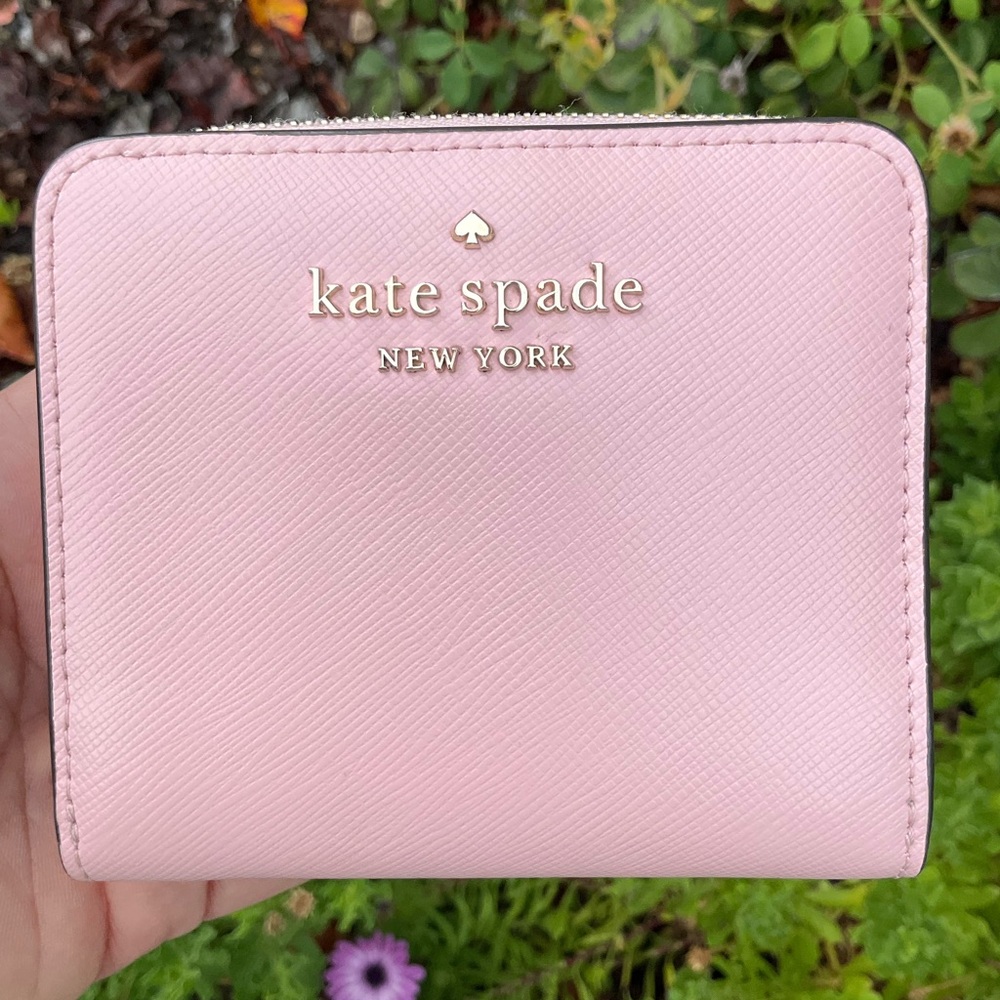 Kate Spade Bifold with zipped card holder compartment.  Like new condition.